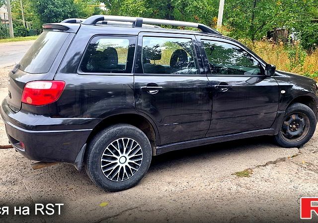 Черный Мицубиси Аутлендер, объемом двигателя 2 л и пробегом 194 тыс. км за 4200 $, фото 1 на Automoto.ua