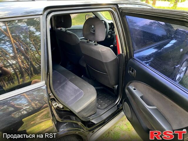 Черный Мицубиси Аутлендер, объемом двигателя 2 л и пробегом 195 тыс. км за 5650 $, фото 6 на Automoto.ua