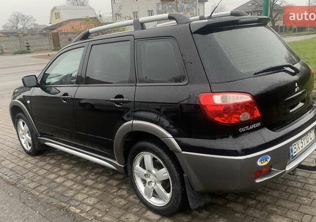 Черный Мицубиси Аутлендер, объемом двигателя 2 л и пробегом 300 тыс. км за 6500 $, фото 6 на Automoto.ua