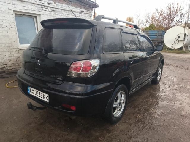 Черный Мицубиси Аутлендер, объемом двигателя 2.4 л и пробегом 3 тыс. км за 5500 $, фото 1 на Automoto.ua