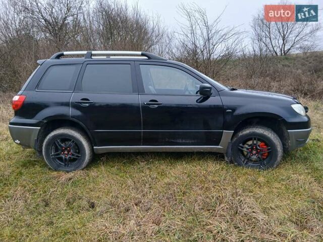 Черный Мицубиси Аутлендер, объемом двигателя 2 л и пробегом 395 тыс. км за 5200 $, фото 17 на Automoto.ua