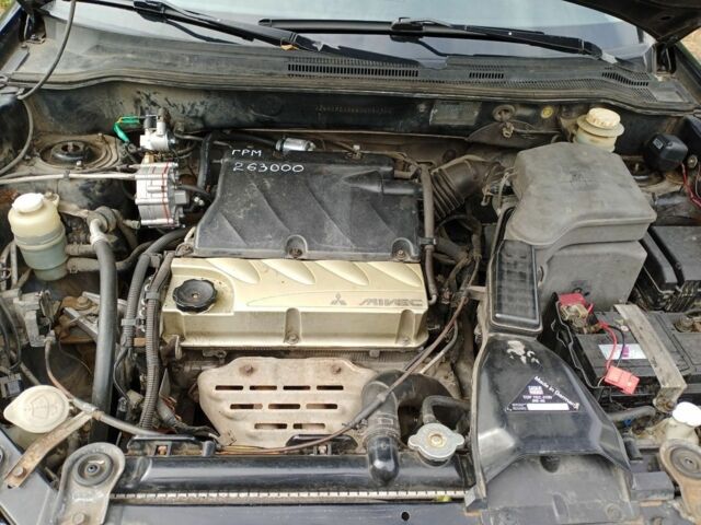 Черный Мицубиси Аутлендер, объемом двигателя 2.4 л и пробегом 269 тыс. км за 5252 $, фото 7 на Automoto.ua