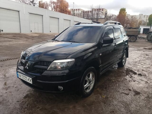 Черный Мицубиси Аутлендер, объемом двигателя 2.4 л и пробегом 3 тыс. км за 5500 $, фото 2 на Automoto.ua