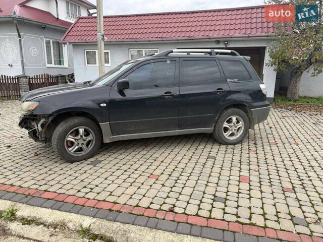 Чорний Міцубісі Аутлендер, об'ємом двигуна 2.38 л та пробігом 294 тис. км за 5000 $, фото 5 на Automoto.ua