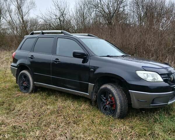 Черный Мицубиси Аутлендер, объемом двигателя 2 л и пробегом 395 тыс. км за 5200 $, фото 11 на Automoto.ua