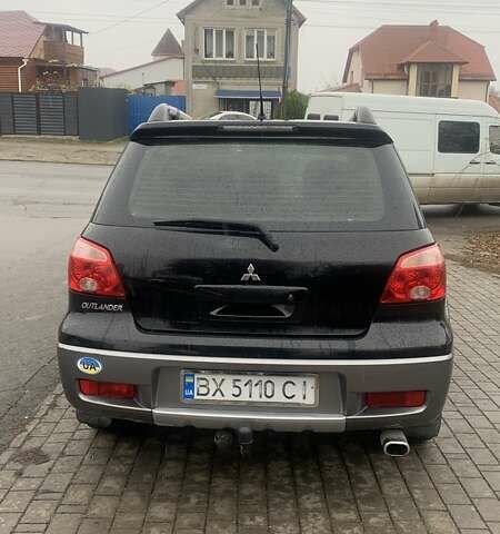 Черный Мицубиси Аутлендер, объемом двигателя 2 л и пробегом 300 тыс. км за 6500 $, фото 4 на Automoto.ua
