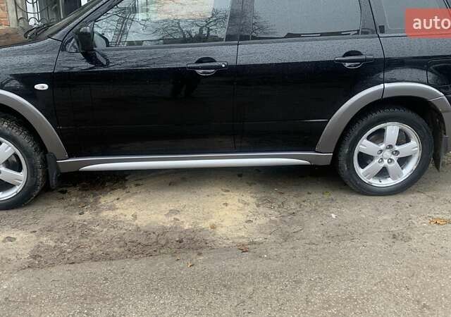 Черный Мицубиси Аутлендер, объемом двигателя 2 л и пробегом 300 тыс. км за 6500 $, фото 15 на Automoto.ua