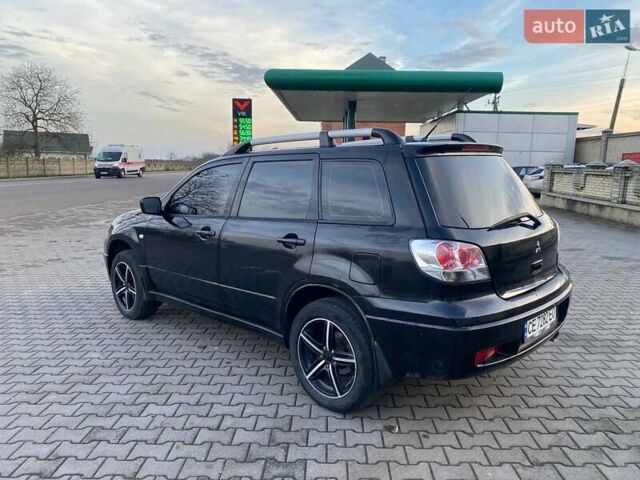 Чорний Міцубісі Аутлендер, об'ємом двигуна 2.38 л та пробігом 294 тис. км за 4550 $, фото 5 на Automoto.ua