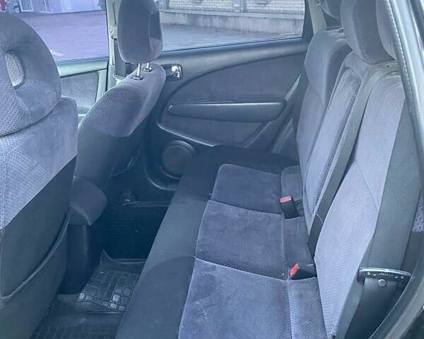 Чорний Міцубісі Аутлендер, об'ємом двигуна 2.38 л та пробігом 294 тис. км за 4550 $, фото 10 на Automoto.ua