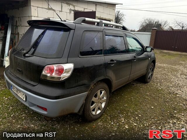 Черный Мицубиси Аутлендер, объемом двигателя 2.4 л и пробегом 357 тыс. км за 5190 $, фото 7 на Automoto.ua