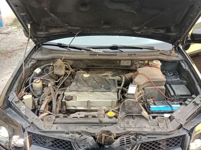 Черный Мицубиси Аутлендер, объемом двигателя 2.4 л и пробегом 243 тыс. км за 1846 $, фото 9 на Automoto.ua