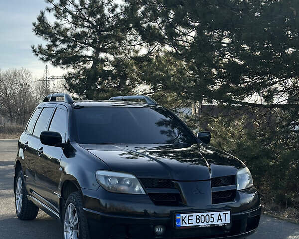 Черный Мицубиси Аутлендер, объемом двигателя 2.4 л и пробегом 240 тыс. км за 6500 $, фото 2 на Automoto.ua