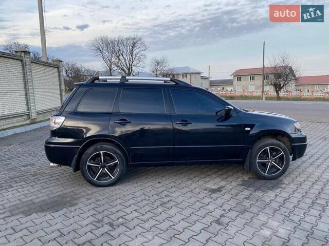 Чорний Міцубісі Аутлендер, об'ємом двигуна 2.38 л та пробігом 294 тис. км за 4550 $, фото 3 на Automoto.ua