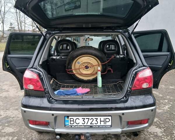 Черный Мицубиси Аутлендер, объемом двигателя 2 л и пробегом 395 тыс. км за 5200 $, фото 9 на Automoto.ua