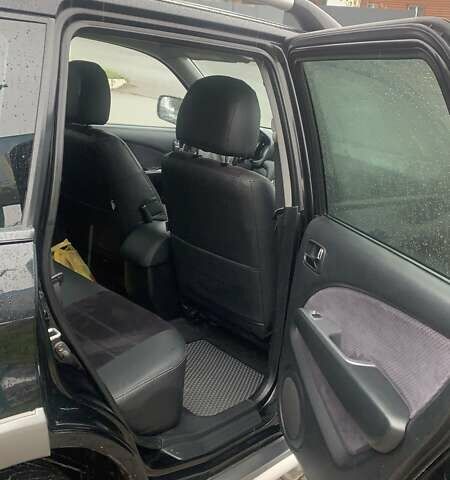 Черный Мицубиси Аутлендер, объемом двигателя 2 л и пробегом 300 тыс. км за 6500 $, фото 12 на Automoto.ua