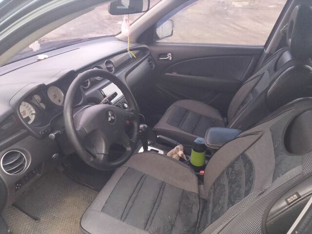 Черный Мицубиси Аутлендер, объемом двигателя 2.4 л и пробегом 3 тыс. км за 5500 $, фото 3 на Automoto.ua