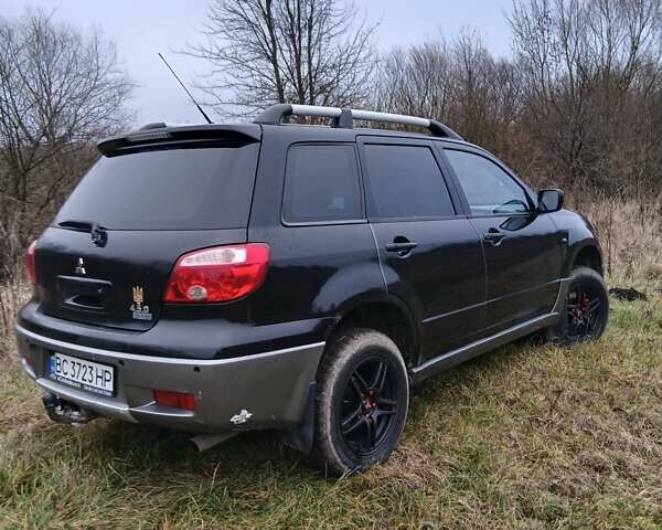 Черный Мицубиси Аутлендер, объемом двигателя 2 л и пробегом 395 тыс. км за 5200 $, фото 14 на Automoto.ua