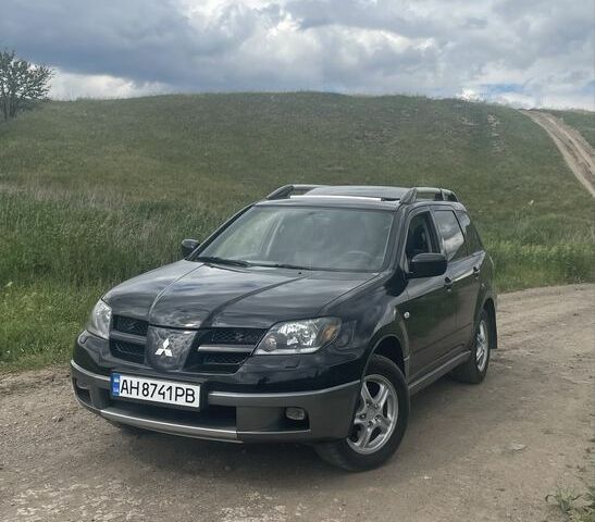 Чорний Міцубісі Аутлендер, об'ємом двигуна 2 л та пробігом 280 тис. км за 5701 $, фото 7 на Automoto.ua