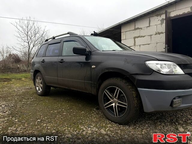 Черный Мицубиси Аутлендер, объемом двигателя 2.4 л и пробегом 357 тыс. км за 5190 $, фото 6 на Automoto.ua