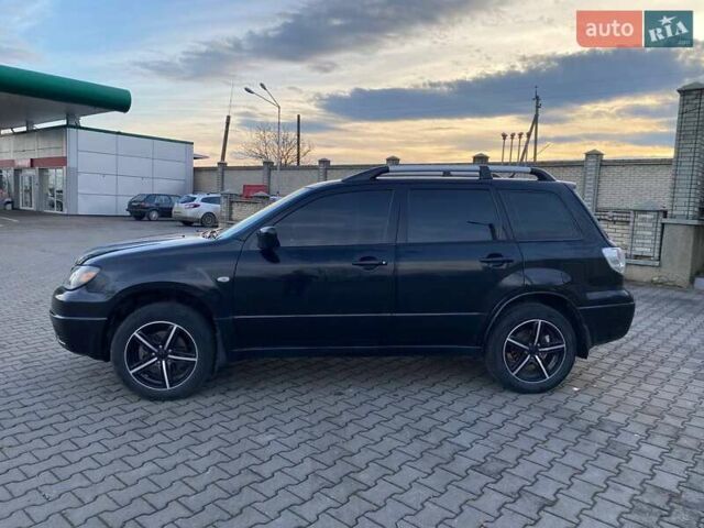 Чорний Міцубісі Аутлендер, об'ємом двигуна 2.38 л та пробігом 294 тис. км за 4550 $, фото 1 на Automoto.ua