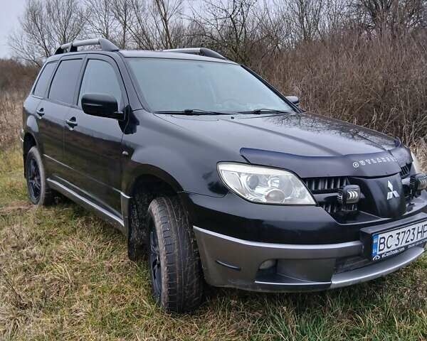 Черный Мицубиси Аутлендер, объемом двигателя 2 л и пробегом 395 тыс. км за 5200 $, фото 16 на Automoto.ua