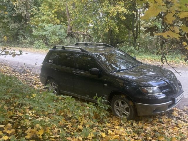 Чорний Міцубісі Аутлендер, об'ємом двигуна 2 л та пробігом 280 тис. км за 5701 $, фото 4 на Automoto.ua