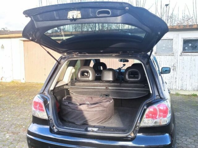 Черный Мицубиси Аутлендер, объемом двигателя 2.4 л и пробегом 269 тыс. км за 5252 $, фото 3 на Automoto.ua