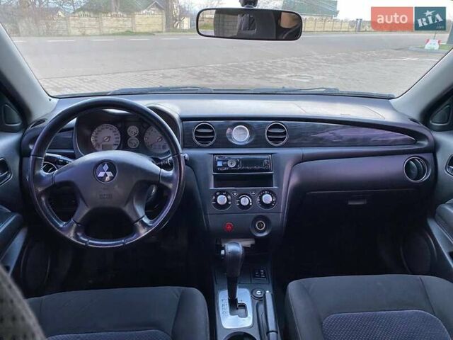 Чорний Міцубісі Аутлендер, об'ємом двигуна 2.38 л та пробігом 294 тис. км за 4550 $, фото 7 на Automoto.ua