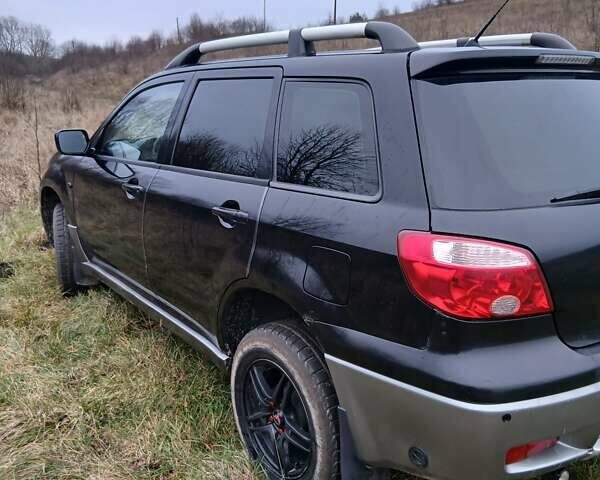 Черный Мицубиси Аутлендер, объемом двигателя 2 л и пробегом 395 тыс. км за 5200 $, фото 15 на Automoto.ua