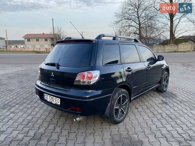 Чорний Міцубісі Аутлендер, об'ємом двигуна 2.38 л та пробігом 294 тис. км за 4550 $, фото 2 на Automoto.ua