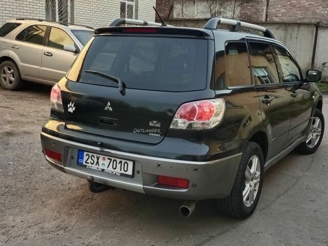 Черный Мицубиси Аутлендер, объемом двигателя 2.4 л и пробегом 243 тыс. км за 1846 $, фото 2 на Automoto.ua