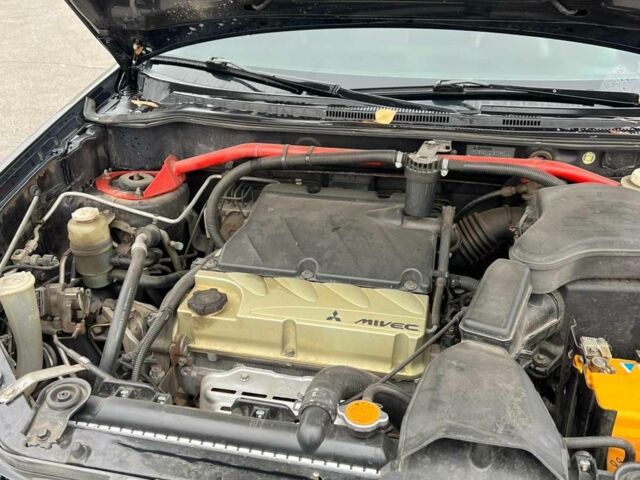 Черный Мицубиси Аутлендер, объемом двигателя 2.4 л и пробегом 190 тыс. км за 6800 $, фото 18 на Automoto.ua