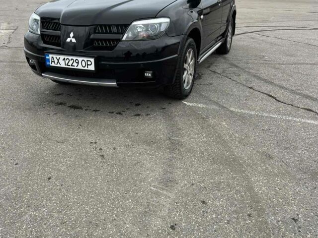 Черный Мицубиси Аутлендер, объемом двигателя 2.4 л и пробегом 190 тыс. км за 6800 $, фото 2 на Automoto.ua