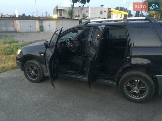 Чорний Міцубісі Аутлендер, об'ємом двигуна 2 л та пробігом 310 тис. км за 6500 $, фото 1 на Automoto.ua