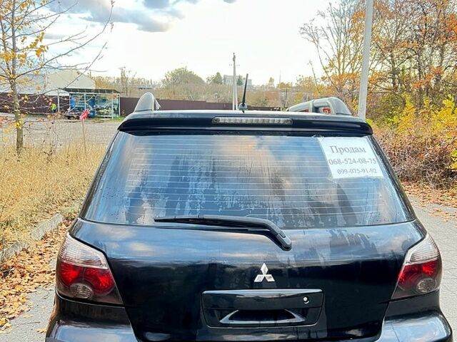 Черный Мицубиси Аутлендер, объемом двигателя 2 л и пробегом 295 тыс. км за 7500 $, фото 4 на Automoto.ua