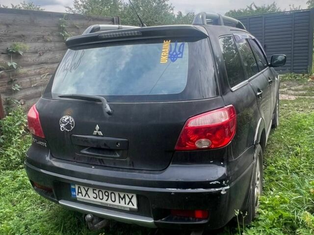 Чорний Міцубісі Аутлендер, об'ємом двигуна 2.4 л та пробігом 288 тис. км за 4200 $, фото 4 на Automoto.ua