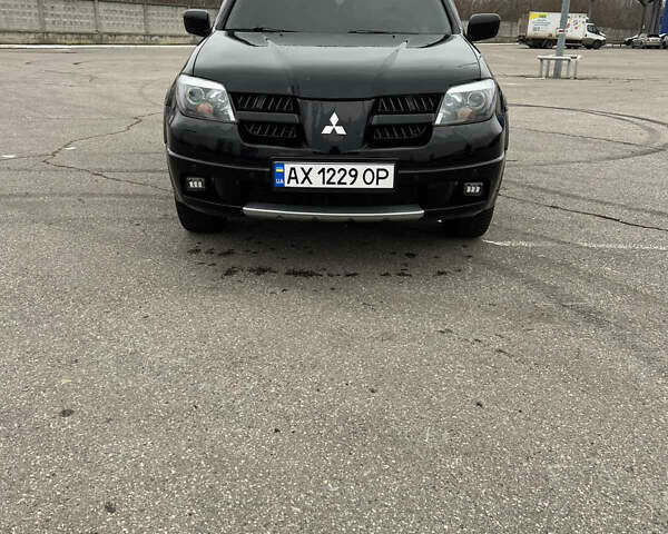 Чорний Міцубісі Аутлендер, об'ємом двигуна 2.38 л та пробігом 190 тис. км за 6800 $, фото 2 на Automoto.ua