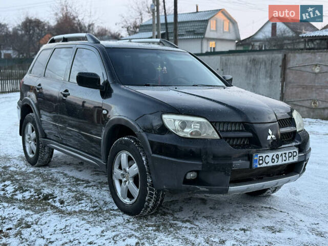 Чорний Міцубісі Аутлендер, об'ємом двигуна 2 л та пробігом 210 тис. км за 4499 $, фото 2 на Automoto.ua