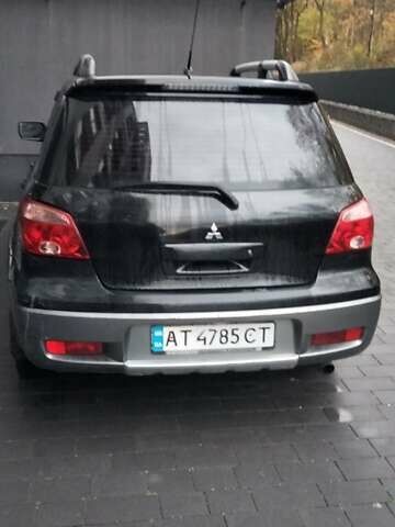 Черный Мицубиси Аутлендер, объемом двигателя 2 л и пробегом 380 тыс. км за 5000 $, фото 3 на Automoto.ua