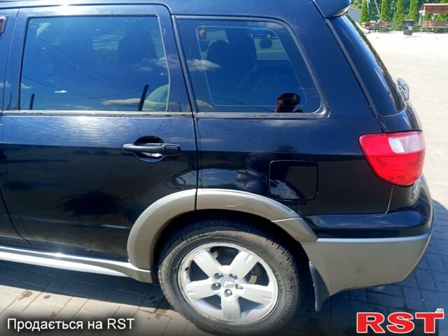 Черный Мицубиси Аутлендер, объемом двигателя 2.4 л и пробегом 270 тыс. км за 7800 $, фото 7 на Automoto.ua