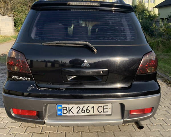 Чорний Міцубісі Аутлендер, об'ємом двигуна 2.4 л та пробігом 285 тис. км за 4300 $, фото 3 на Automoto.ua