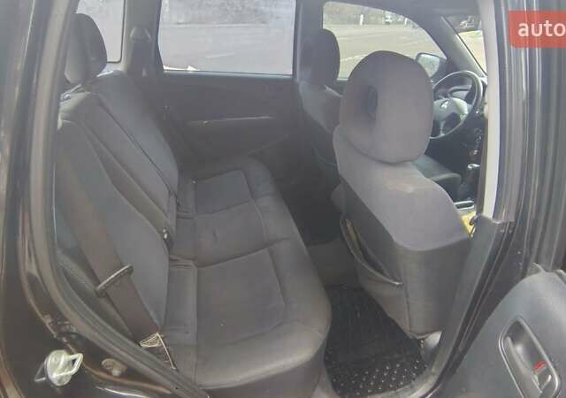 Черный Мицубиси Аутлендер, объемом двигателя 2 л и пробегом 330 тыс. км за 4997 $, фото 13 на Automoto.ua