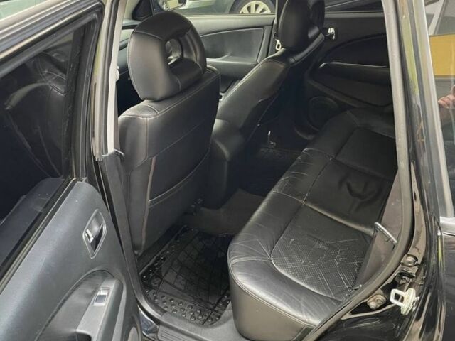 Черный Мицубиси Аутлендер, объемом двигателя 2.38 л и пробегом 270 тыс. км за 5900 $, фото 3 на Automoto.ua