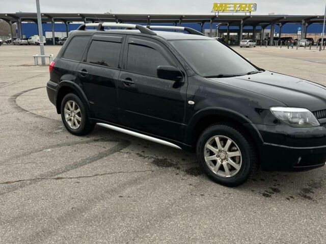 Черный Мицубиси Аутлендер, объемом двигателя 2.4 л и пробегом 190 тыс. км за 6800 $, фото 3 на Automoto.ua