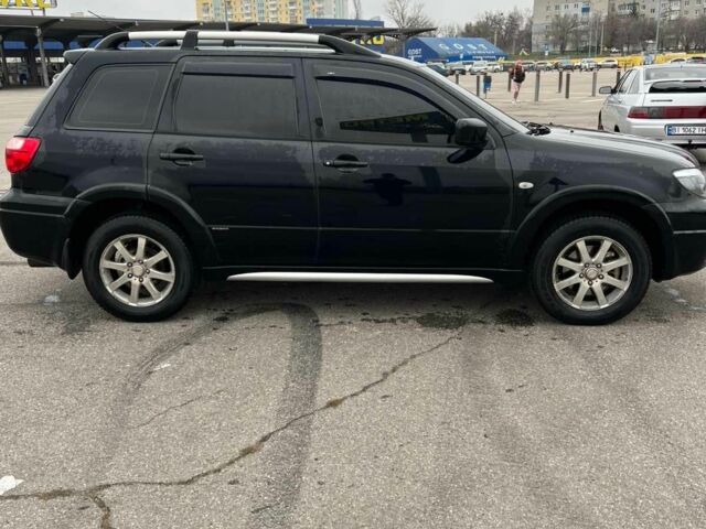 Черный Мицубиси Аутлендер, объемом двигателя 2.4 л и пробегом 190 тыс. км за 6800 $, фото 6 на Automoto.ua
