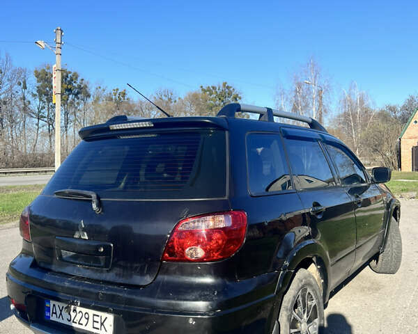 Черный Мицубиси Аутлендер, объемом двигателя 2.4 л и пробегом 300 тыс. км за 4800 $, фото 4 на Automoto.ua