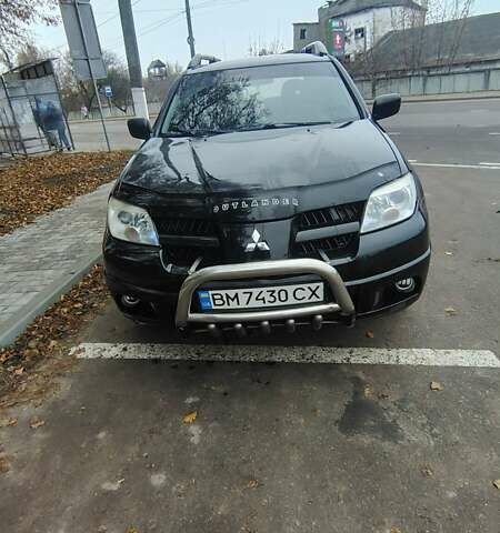 Черный Мицубиси Аутлендер, объемом двигателя 2 л и пробегом 330 тыс. км за 4997 $, фото 1 на Automoto.ua