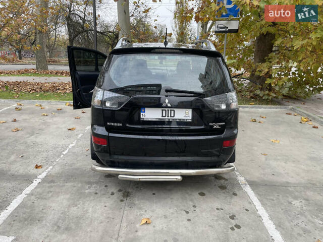 Черный Мицубиси Аутлендер, объемом двигателя 2.4 л и пробегом 300 тыс. км за 8500 $, фото 3 на Automoto.ua