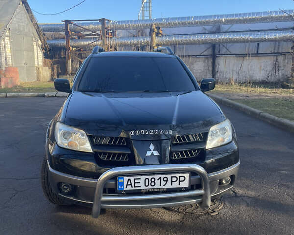 Черный Мицубиси Аутлендер, объемом двигателя 2 л и пробегом 313 тыс. км за 6000 $, фото 3 на Automoto.ua