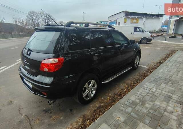 Черный Мицубиси Аутлендер, объемом двигателя 2 л и пробегом 330 тыс. км за 4997 $, фото 3 на Automoto.ua